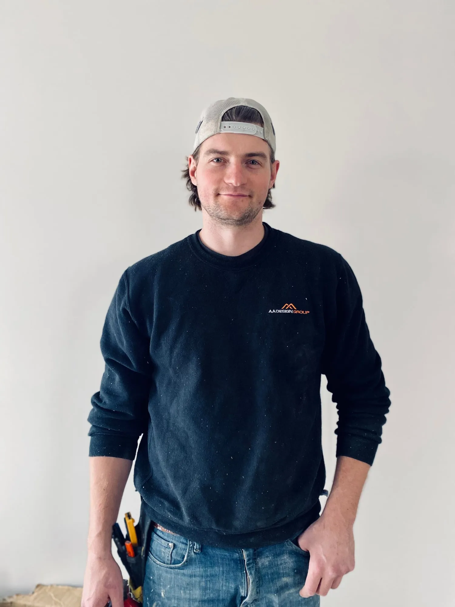 Vlad Aptovcov in an AA Design Group sweatshirt and a cap